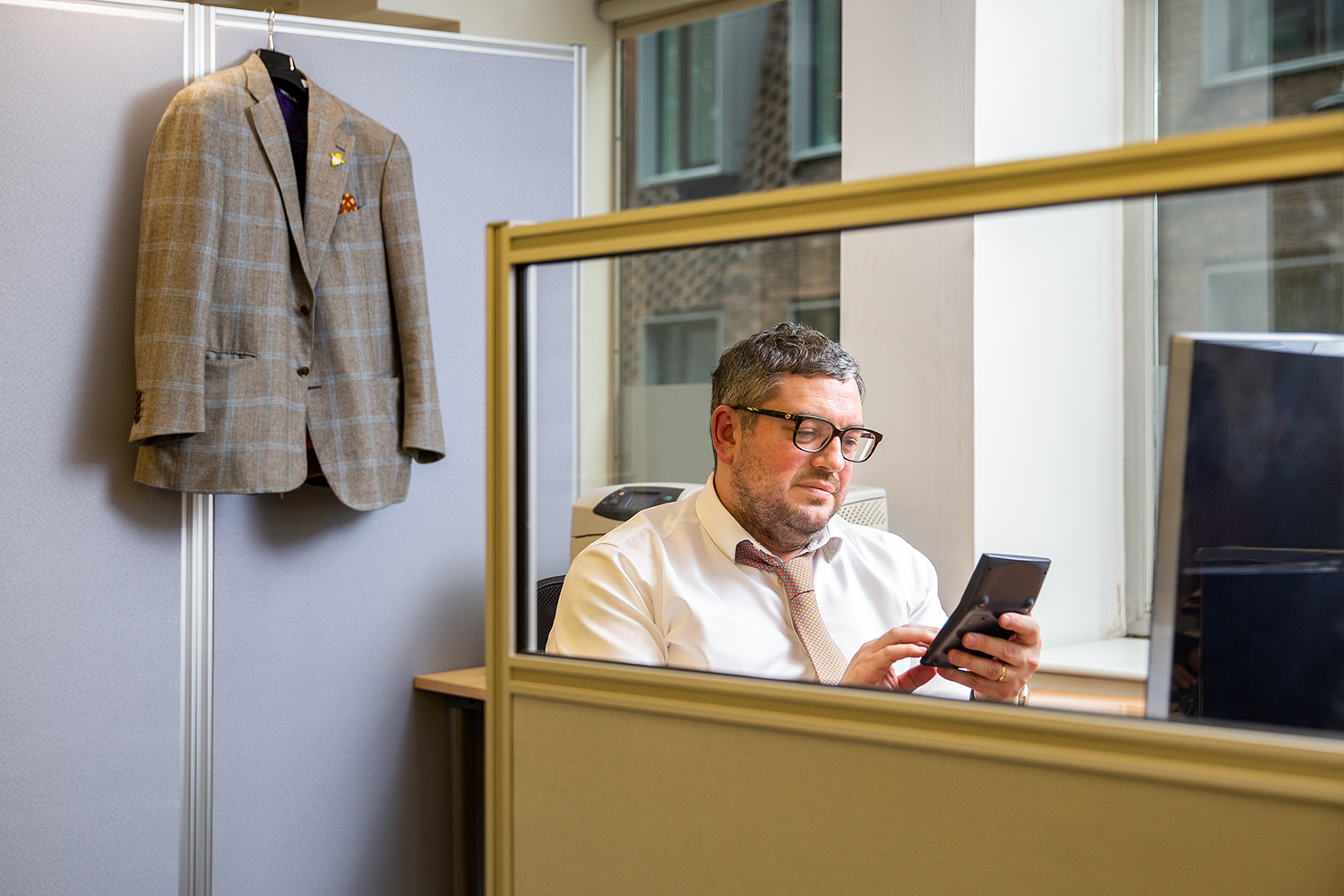 accountant sitting in cubicle